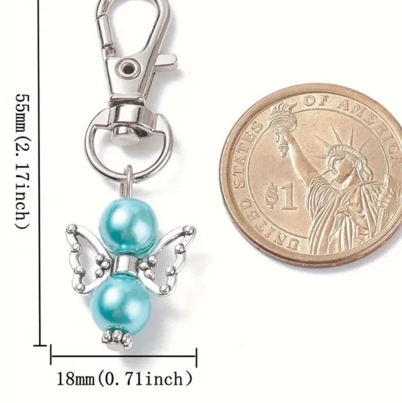 Pearlized angel bag charm NWOT includes box - Picture 2 of 3